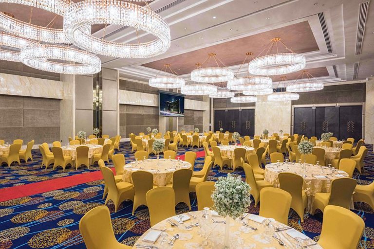 Axminster carpet in blue and gold medallion pattern, hotel ballroom