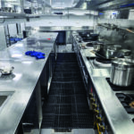 Anti-fatigue kitchen mat installed in a commercial kitchen prep area