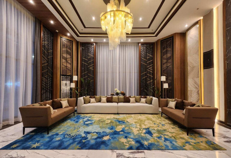 Hotel lounge with sofas and a blue and yellow patterned area rug