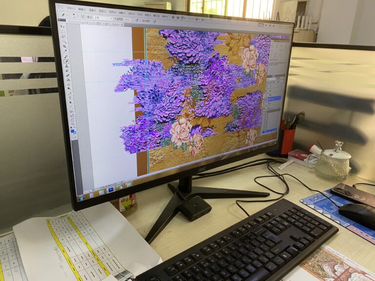 Carpet artwork being developed on a computer monitor